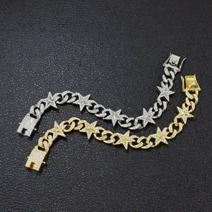 Detailansicht von vereisten Stern-Kubanerketten-Armbändern in Gold- und Silberoptik