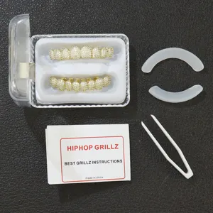 Complete set of gold hip-hop grillz encrusted with zircon stones and accessories