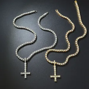 Close-up view of silver and gold hip hop tennis chains with sparkling inverted cross pendants