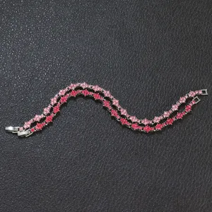Close-up view of the sparkling pink and red rhinestone floral tennis bracelets detail