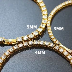 Close-up of 3mm, 4mm, and 5mm gold plated tennis chains with sparkly crystals