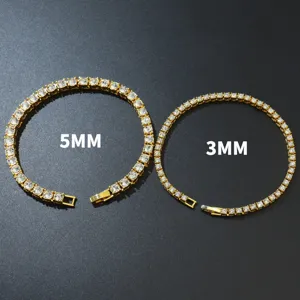 Macro view of two tennis chain bracelets in 3mm and 5mm gold finish with rhinestones.