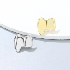 Grillz de colmillos de vampiro de metal oro y plata pulidos para hip-hop y Halloween.