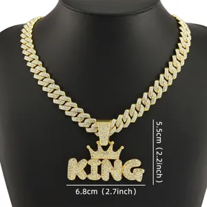 Close-up detail of iced-out KING crown pendant necklace with precise dimension markings