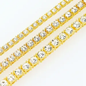 Macro detail of gold tennis chains in 3mm, 4mm, and 5mm sizes with clear rhinestones.