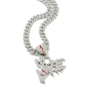 Detailed view of iced-out NO LOVE pendant necklace with red broken heart detail.
