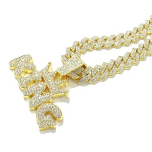 Detailed macro view of the iced-out KING pendant with crown and Cuban link chain.