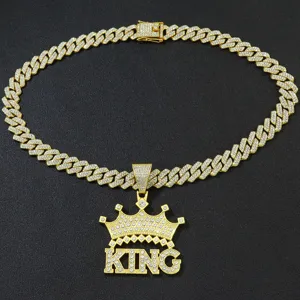Gold-plated hip-hop Cuban link necklace featuring iced-out crown KING letter pendant charm.