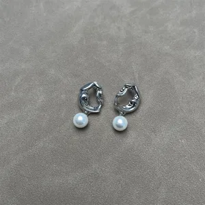 Eleganti orecchini retrò francesi con texture lavica e pendenti di perle da donna