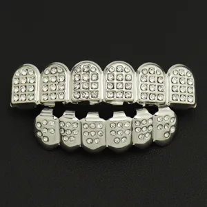 Detailed macro view of silver iced-out hip hop grillz set with stones for teeth
