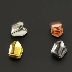 Four different metallic colors of hip-hop single tooth grillz shown on black background