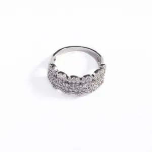 Close-up of elegant silver-colored ring with multi-row micro-pave cubic zirconia stones.