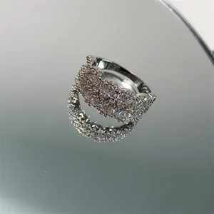 Detailed macro view of heavy industry micro-set zircon full diamond ring on mirror