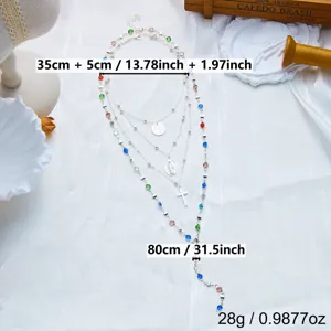 Détail du collier en Y argenté avec croix et strass colorés multicouches