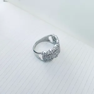 Detailed macro view of silver zircon ring with exquisite micro-pave craftsmanship