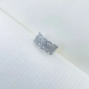 Elegant close-up of a sparkling micro-pave zircon ring with heavy luxury details.