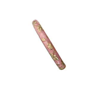 Vintage Chinese style pink enamel bangle with gold floral relief and spring clasp