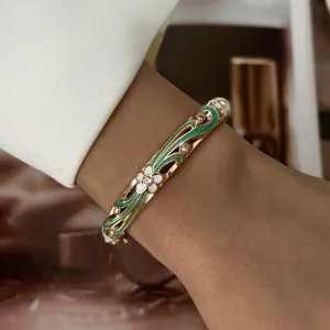 Elegant macaron enamel flower gold bangle bracelet with sparkling crystals on wrist