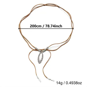 Detailed view of the 200cm brown suede cord necklace with a silver hollowed oval pendant
