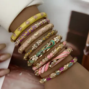 Chic stackable pastel enamel bangles with intricate floral and striped drip oil designs