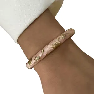 Elegant pink enamel floral bangle with delicate gold flower details for summer style