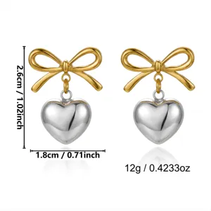 Detailed view of two-tone bow and heart stud earrings with precise measurements and weight