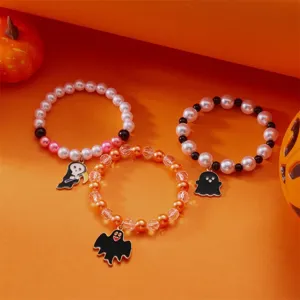 Detailansicht des Halloween-Armband-Sets mit Geister- und Sensenmann-Anhängern