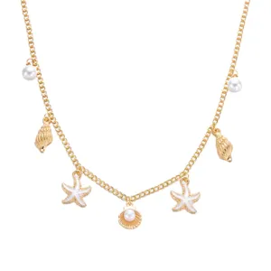 Exquisite detail view of gold necklace with starfish, shell charms and white pearls