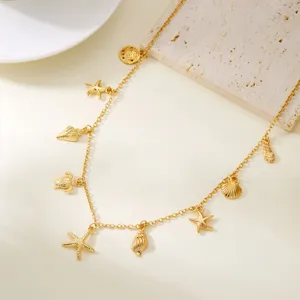 Detailed view of a golden ocean-themed necklace with starfish and shell charms