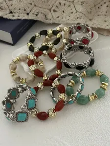 Set van bohemien armbanden met turkoois en metalen kralen in vintage western stijl