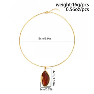 Detailed view of gold choker necklace with irregular amber pendant and measurements