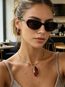 Amber jewelry set featuring gold choker necklace and irregular wavy earrings on model