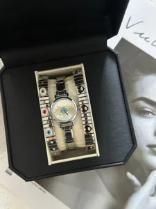 Vintage evil eye watch and heart charm bracelets set in a luxury black gift box display
