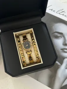 Elegant gold watch with octagonal black dial and two matching rhinestone bracelets