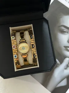 Luxurious gold evil eye watch and black heart charm bracelet set in elegant black gift box