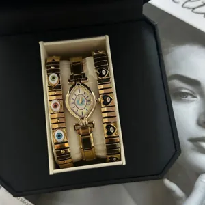 Unique gold-colored marquise Evil Eye watch and matching bracelet set in premium gift box