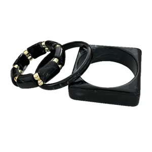 Vintage style black marbled acrylic bangle set featuring elastic and square bracelets