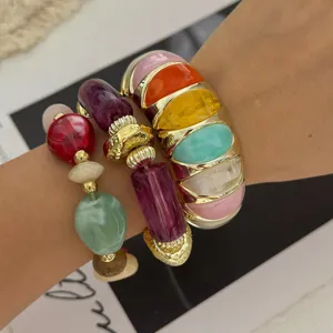 Kleurrijke macaron kralenarmbandenset met gouden accenten om de pols trendy