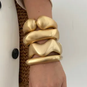 Chunky matte gold geometric wave bracelets with frosted brushed texture for women