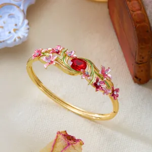 Exquisite vintage enamel floral bangle with red gemstone and hollow vine design details