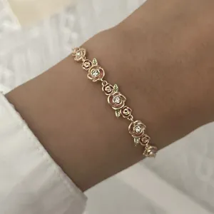 Elegant vintage gold-plated floral bracelet featuring hollow vine patterns and crystals