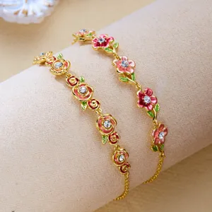 Detailed view of vintage enamel flower bracelets with sparkling crystals