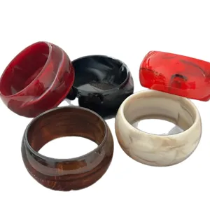 Set of five vintage resin bangles with marbled and mottled textures in assorted colors.