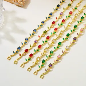 Close-up of colorful rhinestone vine bracelets with elegant gold-plated leaf design