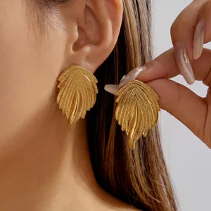 Close-up view of vintage style gold leaf earrings made of high-quality stainless steel