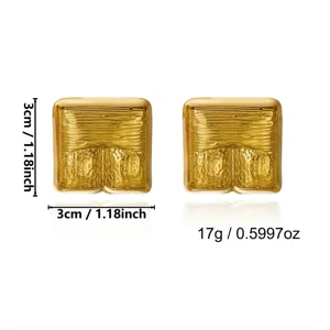 Close-up detail of vintage golden square earrings showing 3cm size and 17g weight