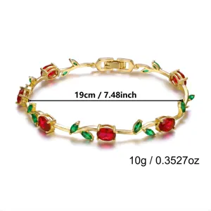 Gold vine bracelet with red and green crystals showing 19cm length and 10g weight.