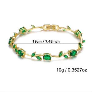 Elegant gold-plated vine bracelet with green gems, showing 19cm length and 10g weight