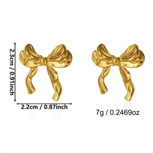 Detailed view of vintage gold bow earrings with size and weight specs