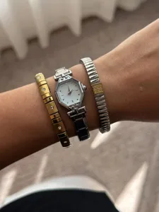 Elegant silver steel watch with hexagonal dial and crystal-encrusted bracelets set